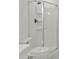 Shower stall in the bathroom featuring sleek hardware, built-in shelving and modern design at 4477 Shady Ln, Punta Gorda, FL 33980