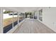 Light-filled sunroom with backyard views, new floors, and sliding glass doors at 4477 Shady Ln, Punta Gorda, FL 33980