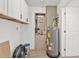 Utility room with cabinets, water heater, and HVAC system at 4477 Shady Ln, Punta Gorda, FL 33980