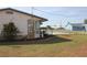 Cozy backyard featuring a fenced in pool, mulch, and grass at 474 Elm Nw Ave, Port Charlotte, FL 33952