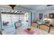View of dining area leading to enclosed sunroom, offering great natural light at 474 Elm Nw Ave, Port Charlotte, FL 33952
