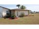 Home with a well-manicured lawn and stone accents at 474 Elm Nw Ave, Port Charlotte, FL 33952