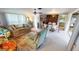 Comfortable living room with sofa, area rug, ceiling fan, and view into dining area at 474 Elm Nw Ave, Port Charlotte, FL 33952
