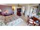 Large main bedroom with adjoining sitting area, ceiling fan and lots of natural light at 474 Elm Nw Ave, Port Charlotte, FL 33952