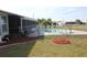 Cozy backyard featuring a fenced in pool and chairs at 474 Elm Nw Ave, Port Charlotte, FL 33952