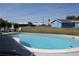 Private kidney-shaped pool in a fenced yard, great for relaxing and enjoying the outdoors at 474 Elm Nw Ave, Port Charlotte, FL 33952