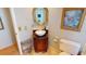 Powder room featuring marble top vanity, decorative mirror, and commode at 474 Elm Nw Ave, Port Charlotte, FL 33952