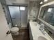 Bathroom featuring a walk-in shower and double sink vanity at 5025 Palena Blvd., North Port, FL 34287