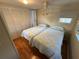 Bedroom featuring two twin beds, closet, ceiling fan, and wood floors at 5025 Palena Blvd., North Port, FL 34287