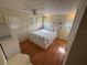 Cozy bedroom with hardwood floors and a comfortable bed at 5025 Palena Blvd., North Port, FL 34287