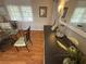 Bright dining space featuring wood floors, wall decor, and plenty of natural light at 5025 Palena Blvd., North Port, FL 34287