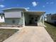 Charming single-story home with a covered carport and well-maintained lawn at 5025 Palena Blvd., North Port, FL 34287