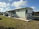 Cozy single-story home with green siding and a charming screened-in porch at 5025 Palena Blvd., North Port, FL 34287