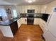 Cozy kitchen features modern appliances, white cabinets, and dark countertops at 5025 Palena Blvd., North Port, FL 34287