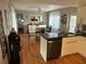 Bright kitchen with stainless steel sink, black appliances, and adjacent dining area at 5025 Palena Blvd., North Port, FL 34287