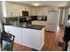 Bright open-concept kitchen with stainless steel appliances and white cabinets at 5025 Palena Blvd., North Port, FL 34287