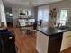 Bright kitchen with stainless steel sink, black appliances, and adjacent dining area at 5025 Palena Blvd., North Port, FL 34287