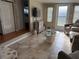 Cozy living room with modern furniture, tile flooring, and seamless kitchen access at 5025 Palena Blvd., North Port, FL 34287