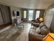 Relaxing living room featuring comfortable seating, a TV, and a decorative coffee table at 5025 Palena Blvd., North Port, FL 34287