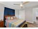 Bedroom with a wooden bed frame, ensuite closet and bright window lighting at 599 Encarnacion St, Punta Gorda, FL 33983