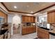 Kitchen showcasing wood-look ceiling, cabinets, granite countertops, and view to other rooms at 599 Encarnacion St, Punta Gorda, FL 33983