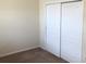 Bedroom features a spacious closet with sliding doors and neutral décor at 6379 Grand Cypress Blvd, North Port, FL 34287