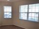 Bedroom with two large windows offering pleasant outdoor views at 6379 Grand Cypress Blvd, North Port, FL 34287