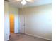 Bedroom featuring ceiling fan, neutral paint, carpet, closet and white doors at 6379 Grand Cypress Blvd, North Port, FL 34287