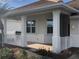 Nice single-story home featuring a tile roof, pillars, white railing, and decorative plants in the front at 6379 Grand Cypress Blvd, North Port, FL 34287