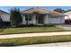 Charming single-story home with a well-manicured lawn and attached two-car garage in a sunny neighborhood at 6379 Grand Cypress Blvd, North Port, FL 34287