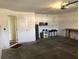 Clean garage interior with access door, shelving for storage, and well-maintained concrete flooring at 6379 Grand Cypress Blvd, North Port, FL 34287