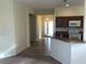 Open-concept kitchen with tile flooring and stainless steel appliances at 6379 Grand Cypress Blvd, North Port, FL 34287