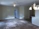 Spacious living room area with neutral carpeting and bright neutral walls at 6379 Grand Cypress Blvd, North Port, FL 34287