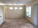 Large living room featuring neutral paint, carpet and decorative chandelier at 6379 Grand Cypress Blvd, North Port, FL 34287
