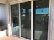 Sliding glass doors lead from the patio to the interior of the home at 6379 Grand Cypress Blvd, North Port, FL 34287