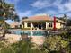 Community pool with lounge chairs and a patio, great for relaxation at 6379 Grand Cypress Blvd, North Port, FL 34287