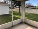 Enjoy the view from this screened-in porch, overlooking a serene backyard with lush green grass at 6379 Grand Cypress Blvd, North Port, FL 34287