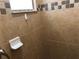 Shower featuring decorative tile and built in soap dish at 6379 Grand Cypress Blvd, North Port, FL 34287