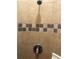 Shower stall with decorative tile and updated shower head at 6379 Grand Cypress Blvd, North Port, FL 34287