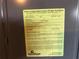 Close-up of a notice of final subterranean termite treatment with contractor's information at 6379 Grand Cypress Blvd, North Port, FL 34287