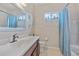 Lovely bathroom featuring a vanity with a modern faucet and a shower-tub combination at 7344 Arrowhead Run, Lakewood Ranch, FL 34202