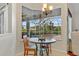 Breakfast nook with a view of the screened lanai and pool at 7344 Arrowhead Run, Lakewood Ranch, FL 34202