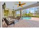 Inviting covered patio with comfortable seating overlooking the screened pool area at 7344 Arrowhead Run, Lakewood Ranch, FL 34202