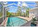 Relaxing backyard pool enclosed with a screen featuring brick patio and an inviting oasis for leisure and recreation at 7344 Arrowhead Run, Lakewood Ranch, FL 34202