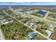 Overhead shot of properties near a highway and bodies of water with varying landscapes at 8081 Dimstead St, Port Charlotte, FL 33981