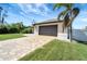 Paver driveway leads to an attached two-car garage in this well maintained residence at 8081 Dimstead St, Port Charlotte, FL 33981