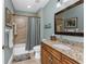 Bathroom with wooden vanity and a shower with a curtain at 95 N Marion Ct # 226, Punta Gorda, FL 33950