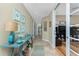 Inviting hallway with coastal decor, tile flooring, and access to multiple rooms at 95 N Marion Ct # 226, Punta Gorda, FL 33950