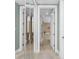 Hallway leads to the bathroom and a mirrored closet at 95 N Marion Ct # 226, Punta Gorda, FL 33950