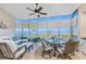 Relaxing lanai with comfortable seating, ceiling fan, and panoramic water views at 95 N Marion Ct # 226, Punta Gorda, FL 33950